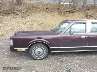 1987 Lincoln Town Car with VIN 1LNBM81F5HY704217, listed as a IAAI auction lot 41855678 with 86,794 mi miles. Bid and sale history available at carsss.com. Image 6.