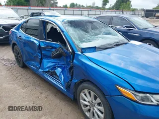 2019 Toyota Camry LE with VIN 4T1B11HK7KU259920, listed as a IAAI auction lot 42115493 with 69,254 mi miles and . Bid and sale history available at DreamBid. Image 6.