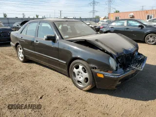 2002 Mercedes-Benz E-Class with VIN WDBJF70J22B489706, listed as a Copart auction lot 71109874 with 59,167 mi miles and Salvage Title. Bid and sale history available at carsss.com. Image 4.