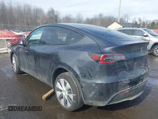 2024 Tesla Model Y Long Range with VIN 7SAYGDEE8RF084936, listed as a IAAI auction lot 41615104 with 14,622 mi miles. Bid and sale history available at carsss.com. Image 3.