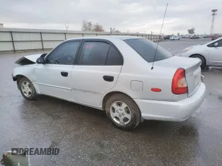 2002 Hyundai Accent GL with VIN KMHCG45C02U301443, listed as a Copart auction lot 80670164 with 124,163 mi miles and Salvage Title. Bid and sale history available at carsss.com. Image 2.