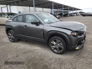 2022 Mazda MX-30 Premium Plus Package with VIN JM1DRADB4N0100893, listed as a Copart auction lot 46955985 with 25,705 mi miles and Salvage Title. Bid and sale history available at carsss.com. Image 4.