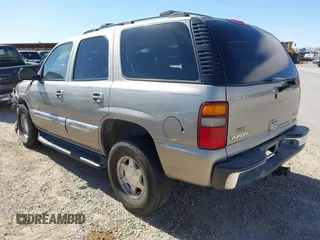 2003 GMC Yukon SLT with VIN 1GKEC13V33R298333, listed as a IAAI auction lot 41582447 with 166,047 mi miles. Bid and sale history available at carsss.com. Image 3.