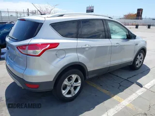 2016 Ford Escape SE with VIN 1FMCU0GX7GUB72822, listed as a IAAI auction lot 42136764 with 98,497 mi miles. Bid and sale history available at carsss.com. Image 4.
