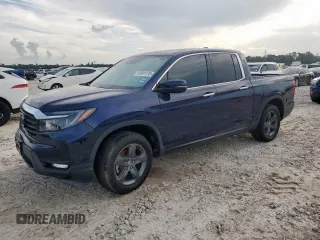 2023 Honda Ridgeline RTL-E with VIN 5FPYK3F74PB023755, listed as a Copart auction lot 61841115 with 26,304 mi miles and Salvage title. Bid and sale history available at DreamBid. Image 1.