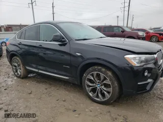 2015 BMW X4 xDrive28i with VIN 5UXXW3C58F0M87154, listed as a Copart auction lot 69211092 with 147,960 mi miles. Bid and sale history available at carsss.com. Image 4.