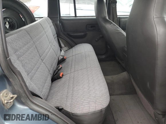 1999 Jeep Cherokee SE with VIN 1J4FF28S9XL576313, listed as a Copart auction lot 88470435 with Not provided miles and Salvage title. Bid and sale history available at DreamBid. Image 11.