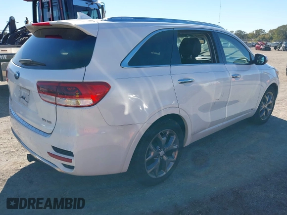2016 Kia Sorento SX z VIN 5XYPKDA5XGG173541, wystawiony jako IAAI lot #40916121 z przebiegiem Nie podano mil oraz . Historia ofert i sprzedaży dostępna na DreamBid. Obrazek 4.