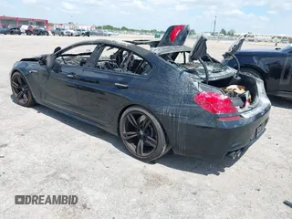 2019 BMW M6 z VIN WBS6E9C59KG808373, wystawiony jako IAAI lot #42170454 z przebiegiem Nie podano mil oraz . Historia ofert i sprzedaży dostępna na DreamBid. Obrazek 3.