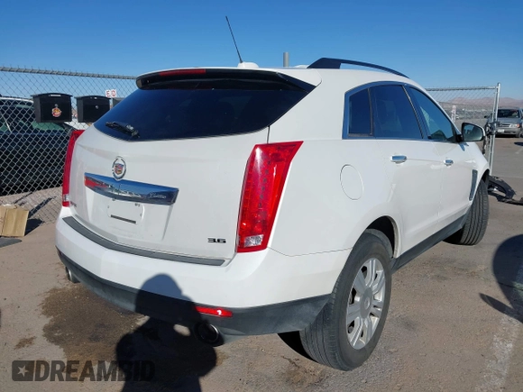 2015 Cadillac SRX with VIN 3GYFNAE34FS557297, listed as a IAAI auction lot 41388573 with 124,185 mi miles and . Bid and sale history available at DreamBid. Image 4.