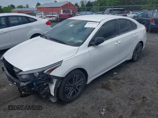 2023 Kia Forte GT-Line z VIN 3KPF54ADXPE621767, wystawiony jako IAAI lot #41991079 z przebiegiem 27 124 mil mil oraz . Historia ofert i sprzedaży dostępna na DreamBid. Obrazek 2.