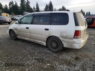 1998 Honda Odyssey with VIN RA31038664, listed as a Copart auction lot 43051785 with 106,084 mi miles and Salvage title. Bid and sale history available at DreamBid. Image 2.