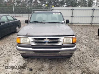 1996 Ford Ranger XL z VIN 1FTCR10A2TUD70395, wystawiony jako Copart lot #52977425 z przebiegiem 403 506 mil mil oraz Nie do naprawy. Historia ofert i sprzedaży dostępna na DreamBid. Obrazek 5.