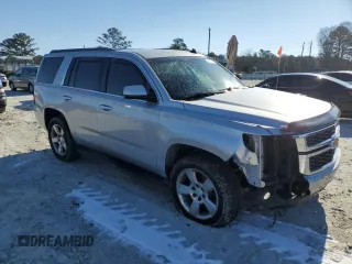 2015 Chevrolet Tahoe LT with VIN 1GNSCBKC5FR292582, listed as a Copart auction lot 42202885 with 152,388 mi miles and Salvage Title. Bid and sale history available at DreamBid. Image 4.