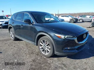 2021 Mazda CX-5 Grand Touring with VIN JM3KFBDM4M0471467, listed as a IAAI auction lot 41825406 with 43,529 mi miles. Bid and sale history available at carsss.com. Image 1.