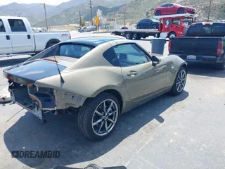 2023 Mazda MX-5 Miata Grand Touring z VIN JM1NDAM73P0561844, wystawiony jako IAAI lot #42195198 z przebiegiem 6 020 mil mil oraz . Historia ofert i sprzedaży dostępna na DreamBid. Obrazek 4.