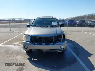 2005 GMC Envoy SLE z VIN 1GKDT13S252331044, wystawiony jako IAAI lot #41749219 z przebiegiem 263 876 mil mil oraz . Historia ofert i sprzedaży dostępna na DreamBid. Obrazek 13.