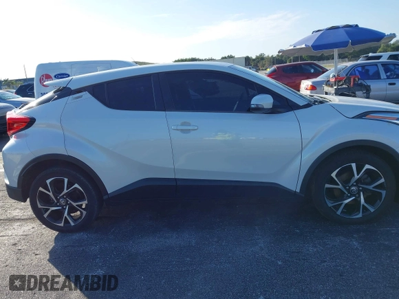 2021 Toyota C-HR LE with VIN NMTKHMBX0MR123981, listed as a IAAI auction lot 41273382 with 51,988 mi miles. Bid and sale history available at carsss.com. Image 13.