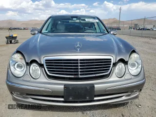 2004 Mercedes-Benz E-Class 5.0L with VIN WDBUF70J54A496963, listed as a Copart auction lot 64214634 with 113,575 mi miles and Salvage Title. Bid and sale history available at carsss.com. Image 5.
