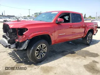 2023 Toyota Tacoma SR with VIN 3TMCZ5AN9PM609234, listed as a Copart auction lot 55158415 with 26,576 mi miles and Salvage title. Bid and sale history available at DreamBid. Image 1.