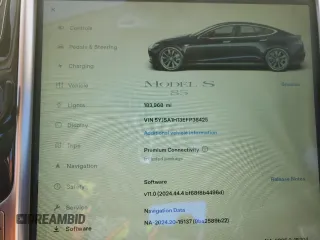 2014 Tesla Model S 60 with VIN 5YJSA1H13EFP38425, listed as a Copart auction lot 63686205 with 183,968 mi miles and Salvage title. Bid and sale history available at DreamBid. Image 9.