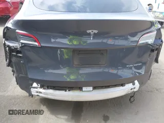 2022 Tesla Model Y Long Range z VIN 7SAYGDEE6NF364994, wystawiony jako IAAI lot #42322587 z przebiegiem 41 572 mil mil oraz . Historia ofert i sprzedaży dostępna na DreamBid. Obrazek 6.