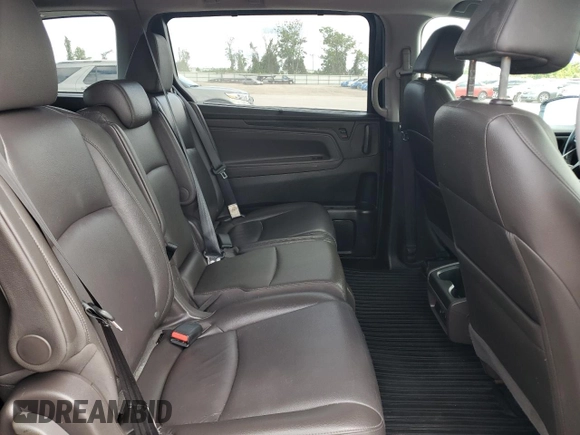2018 Honda Odyssey EX-L z VIN 5FNRL6H7XJB031245, wystawiony jako Copart lot #59331635 z przebiegiem 74 901 mil mil oraz Czysty tytuł • Clean title. Historia ofert i sprzedaży dostępna na DreamBid. Obrazek 11.