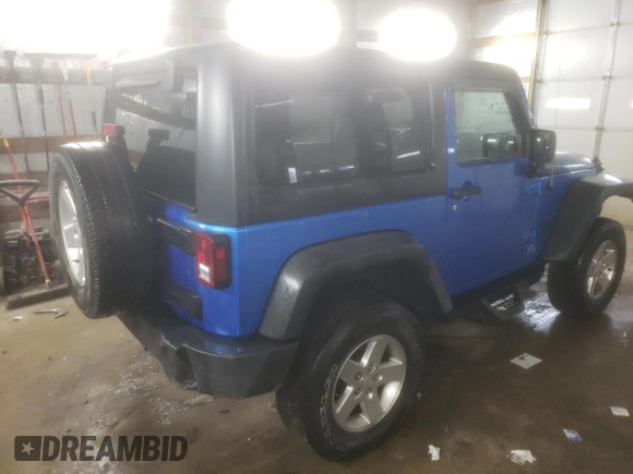2015 Jeep Wrangler Willys Wheeler with VIN 1C4AJWAG2FL568130, listed as a Copart auction lot 80682914 with 111,686 mi miles and Salvage title. Bid and sale history available at DreamBid. Image 3.