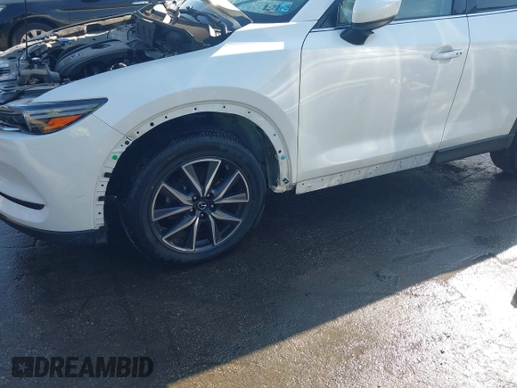 2018 Mazda CX-5 Grand Touring z VIN JM3KFBDM8J0420422, wystawiony jako IAAI lot #42188348 z przebiegiem 102 216 mil mil oraz . Historia ofert i sprzedaży dostępna na DreamBid. Obrazek 18.