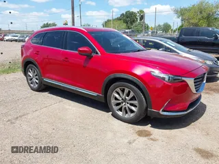 2017 Mazda CX-9 Grand Touring with VIN JM3TCADY3H0140895, listed as a IAAI auction lot 42817948 with 125,288 mi miles and . Bid and sale history available at DreamBid. Image 1.