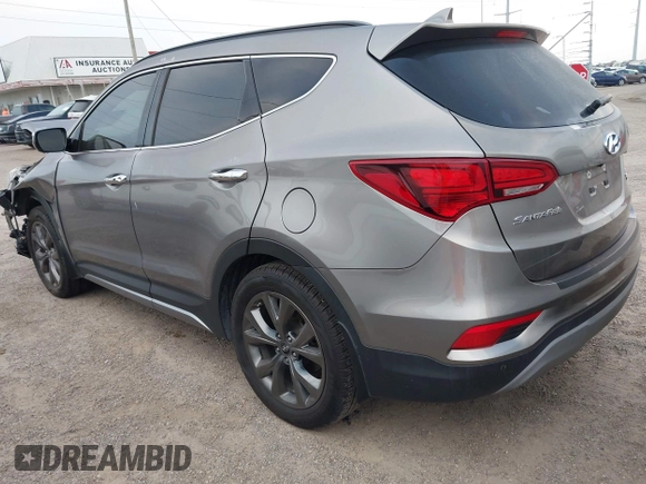 2018 Hyundai Santa Fe Ultimate with VIN 5NMZWDLAXJH100108, listed as a IAAI auction lot 42126768 with 68,325 mi miles and . Bid and sale history available at DreamBid. Image 3.