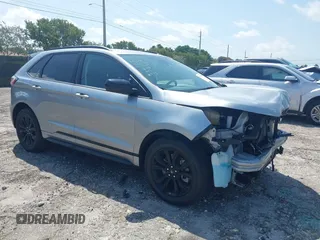 2024 Ford Edge SE z VIN 2FMPK4G91RBA63054, wystawiony jako IAAI lot #41973609 z przebiegiem 14 707 mil mil oraz . Historia ofert i sprzedaży dostępna na DreamBid. Obrazek 1.