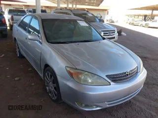 2003 Toyota Camry LE with VIN JTDBE32K730176610, listed as a IAAI auction lot 41627010 with 238,502 mi miles and . Bid and sale history available at DreamBid. Image 1.