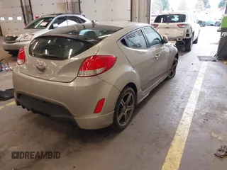 2013 Hyundai Veloster w/Black Int with VIN KMHTC6AD2DU128534, listed as a IAAI auction lot 41791398 with 158,414 mi miles and . Bid and sale history available at DreamBid. Image 4.