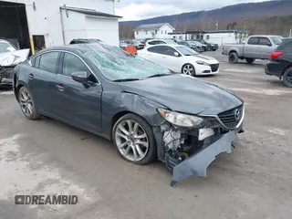 2014 Mazda 6 i Touring with VIN JM1GJ1T62E1131014, listed as a IAAI auction lot 40904979 with 169,605 mi miles and . Bid and sale history available at DreamBid. Image 1.