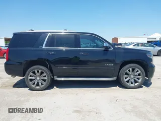 2015 Chevrolet Tahoe LTZ with VIN 1GNSCCKC4FR309152, listed as a IAAI auction lot 42029341 with 187,313 mi miles and . Bid and sale history available at DreamBid. Image 13.