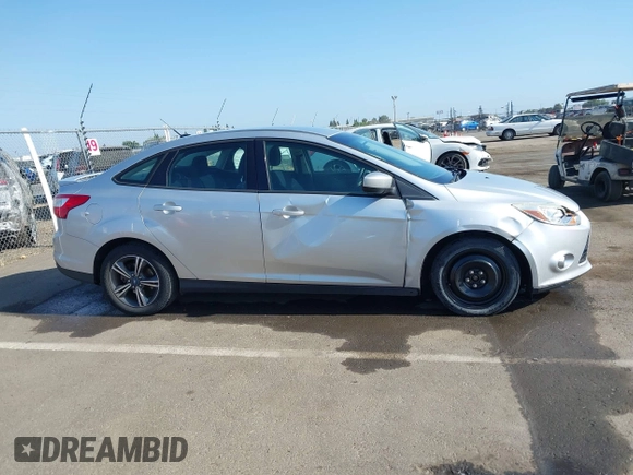 2012 Ford Focus SE z VIN 1FAHP3F28CL215997, wystawiony jako IAAI lot #42483639 z przebiegiem 101 518 mil mil oraz . Historia ofert i sprzedaży dostępna na DreamBid. Obrazek 13.