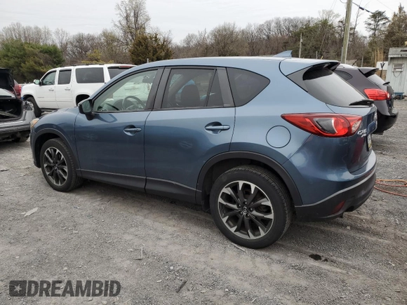 2016 Mazda CX-5 Grand Touring with VIN JM3KE4DY7G0761594, listed as a Copart auction lot 51514595 with 58,250 mi miles and Salvage Title. Bid and sale history available at DreamBid. Image 2.