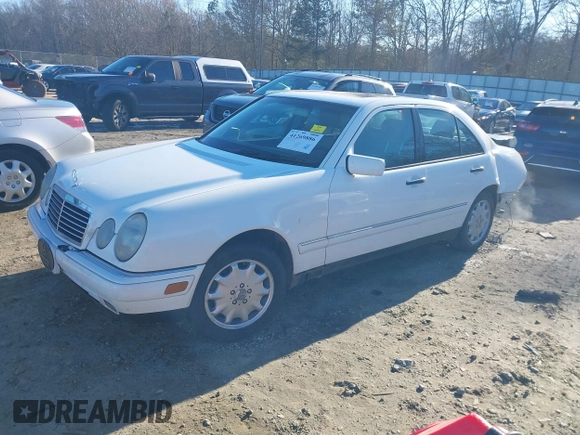 1999 Mercedes-Benz E-Class with VIN WDBJF82H0XX015778, listed as a IAAI auction lot 41269886 with 184,011 mi miles. Bid and sale history available at carsss.com. Image 2.