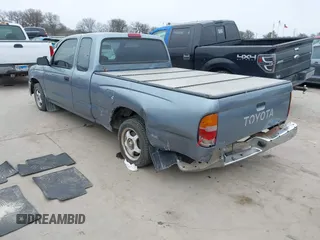 1997 Toyota Tacoma with VIN 4TAVL52N0VZ311543, listed as a IAAI auction lot 41644677 with 292,131 mi miles. Bid and sale history available at carsss.com. Image 3.