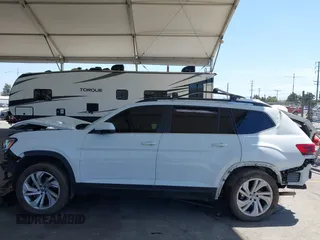 2021 Volkswagen Atlas SE z VIN 1V2HR2CA8MC514027, wystawiony jako IAAI lot #42260413 z przebiegiem 37 687 mil mil oraz . Historia ofert i sprzedaży dostępna na DreamBid. Obrazek 14.