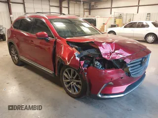 2018 Mazda CX-9 Grand Touring z VIN JM3TCADY0J0206275, wystawiony jako IAAI lot #41374778 z przebiegiem 143 994 mil mil oraz . Historia ofert i sprzedaży dostępna na DreamBid. Obrazek 1.