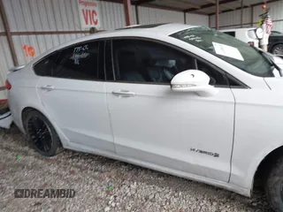 2017 Ford Fusion Hybrid Titanium with VIN 3FA6P0RU1HR322997, listed as a IAAI auction lot 41506630 with 263,589 mi miles and . Bid and sale history available at DreamBid. Image 13.