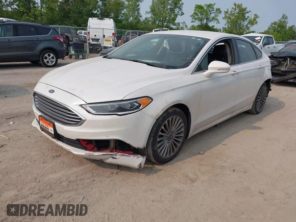 2017 Ford Fusion Titanium z VIN 3FA6P0K92HR396113, wystawiony jako IAAI lot #42402969 z przebiegiem 185 620 mil mil oraz . Historia ofert i sprzedaży dostępna na DreamBid. Obrazek 17.
