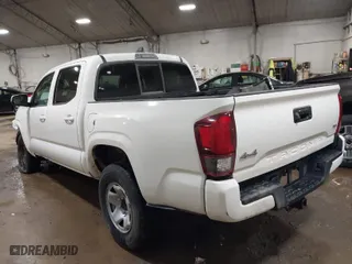 2023 Toyota Tacoma 4WD SR with VIN 3TMCZ5AN7PM571924, listed as a IAAI auction lot 41219097 with 34,292 mi miles. Bid and sale history available at carsss.com. Image 3.