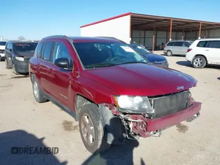 2014 Jeep Compass Sport with VIN 1C4NJCBA3ED812435, listed as a IAAI auction lot 41424374 with 174,663 mi miles and . Bid and sale history available at DreamBid. Image 1.