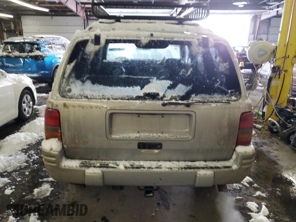 1997 Jeep Grand Cherokee Limited with VIN 1J4GZ78Y1VC706353, listed as a Copart auction lot 41437085 with 163,675 mi miles and Salvage Title. Bid and sale history available at carsss.com. Image 6.