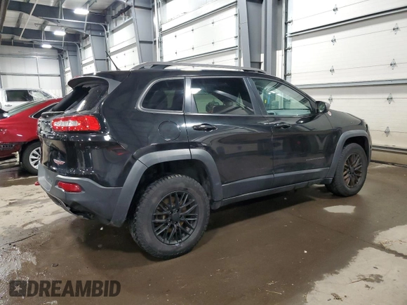 2014 Jeep Cherokee Trailhawk with VIN 1C4PJMBS5EW294212, listed as a Copart auction lot 88816885 with 151,779 mi miles and Salvage title. Bid and sale history available at DreamBid. Image 3.