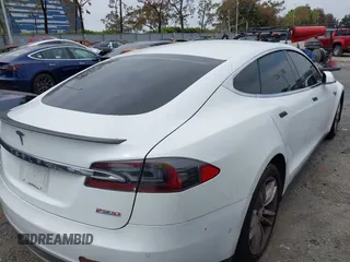 2016 Tesla Model S 90D with VIN 5YJSA1E40GF123543, listed as a IAAI auction lot 42111603 with 126,445 mi miles and . Bid and sale history available at DreamBid. Image 4.