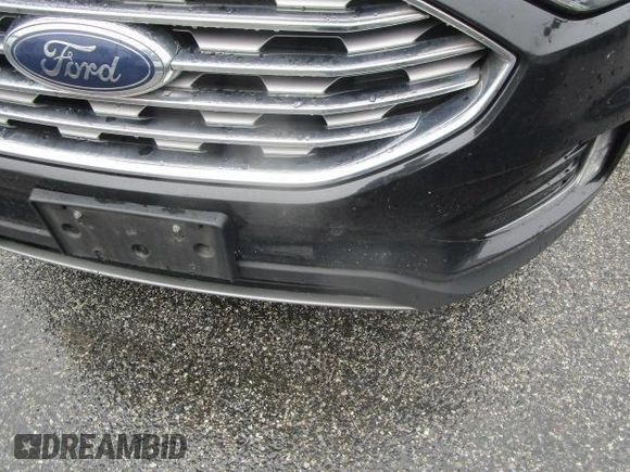 2020 Ford Edge Titanium z VIN 2FMPK3K95LBB37553, wystawiony jako IAAI lot #42407489 z przebiegiem 105 572 mil mil oraz . Historia ofert i sprzedaży dostępna na DreamBid. Obrazek 1.